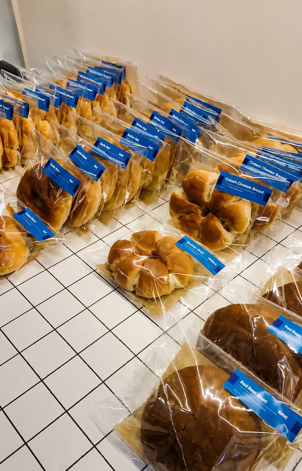 The morning's breads, bagged and labelled for the day